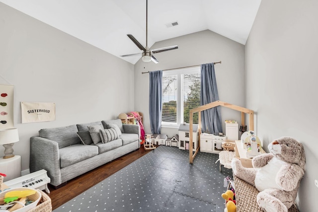 living room with ceiling fan and vaulted ceiling