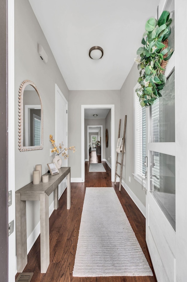 corridor featuring dark wood-type flooring