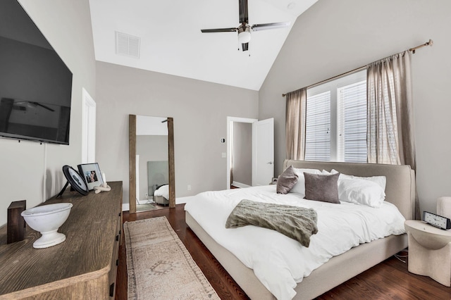 bedroom featuring ceiling fan, dark hardwood / wood-style floors, and high vaulted ceiling