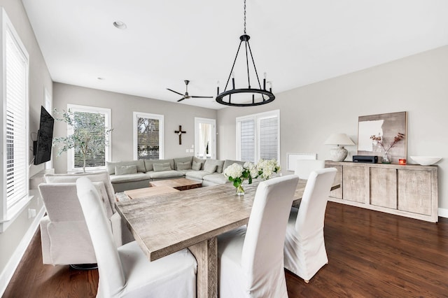 dining room featuring dark hardwood / wood-style floors and a chandelier