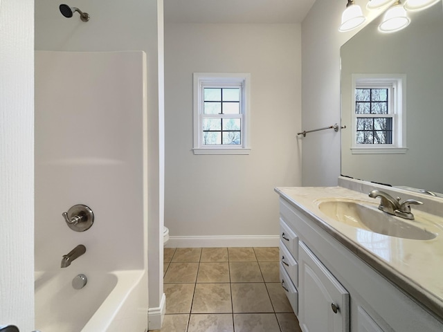 full bathroom with tile patterned flooring, vanity, washtub / shower combination, and toilet