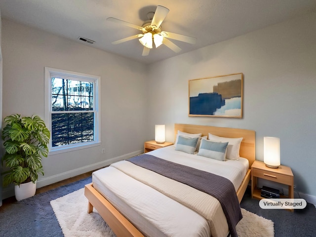 bedroom with dark wood-type flooring and ceiling fan