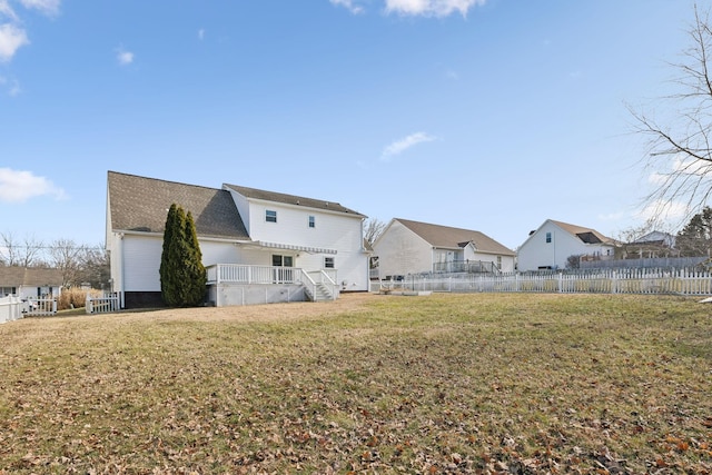 back of property featuring a lawn