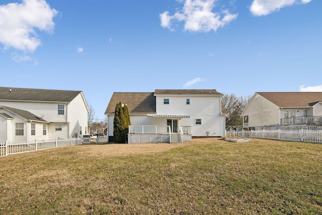 rear view of property with a lawn