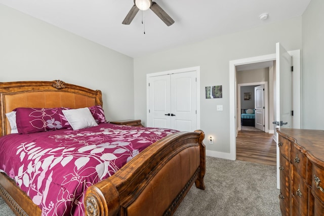 carpeted bedroom featuring a closet and ceiling fan