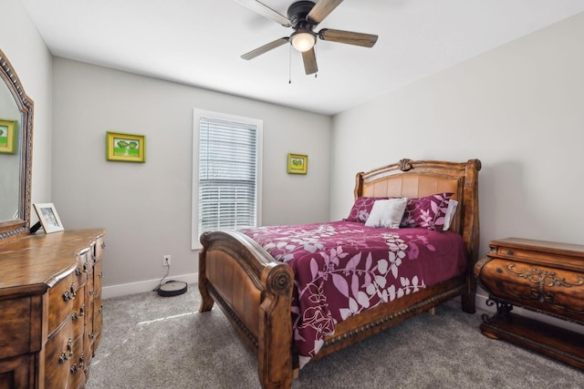 bedroom featuring dark carpet and ceiling fan