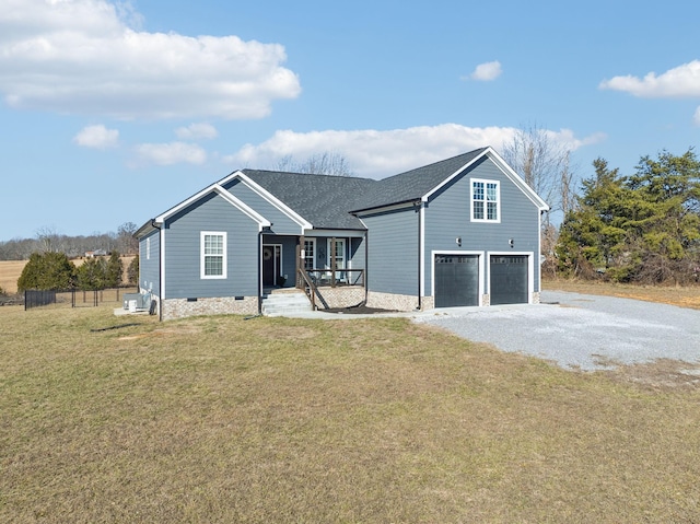 view of front of house featuring a garage, covered porch, and a front lawn