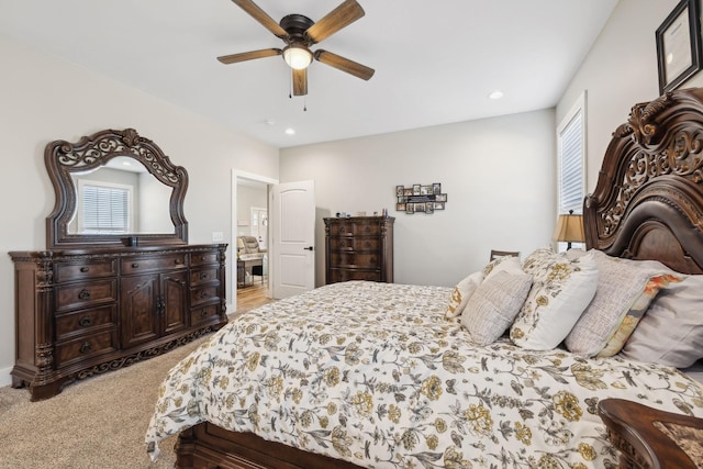 carpeted bedroom with ceiling fan