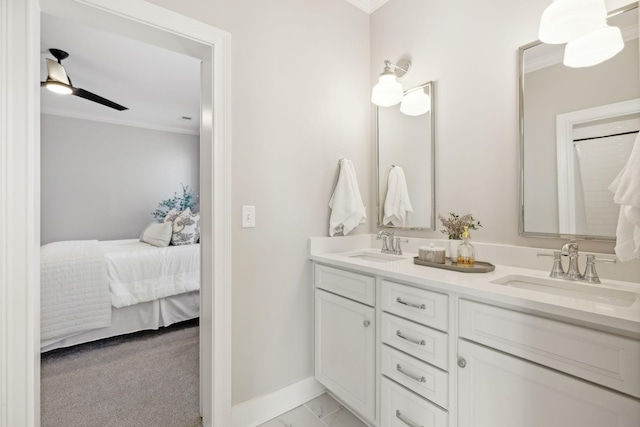 bathroom featuring ornamental molding and vanity