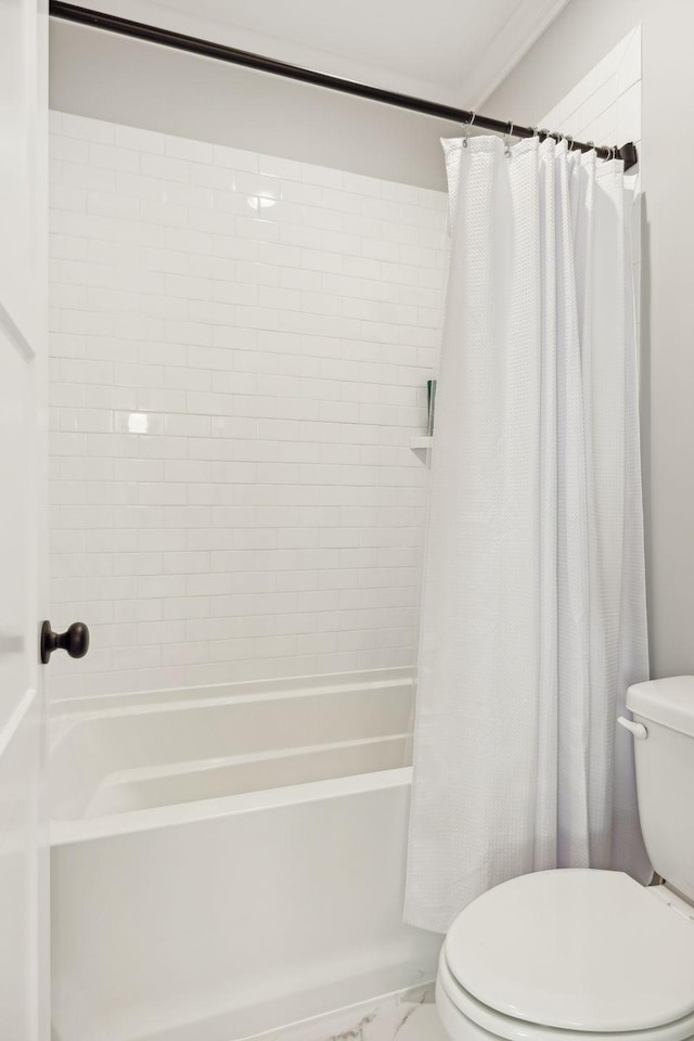 bathroom with shower / tub combo with curtain and toilet