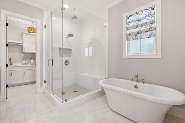 bathroom featuring vanity and independent shower and bath