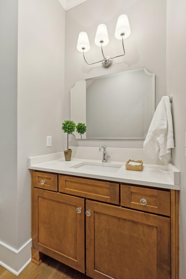 bathroom with vanity and hardwood / wood-style flooring