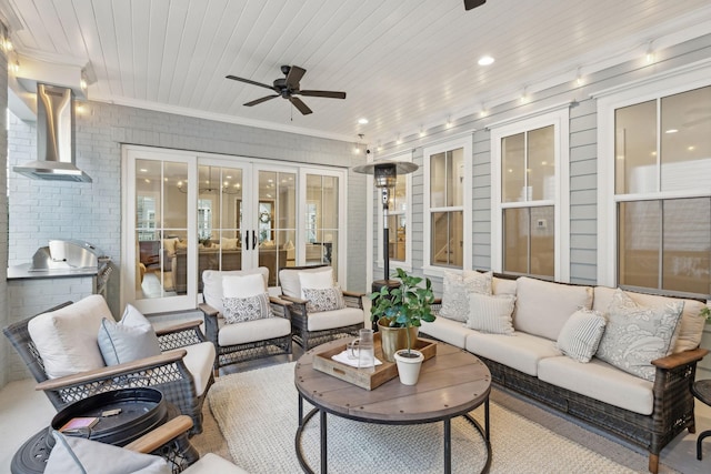 interior space with area for grilling, an outdoor hangout area, ceiling fan, and exterior kitchen