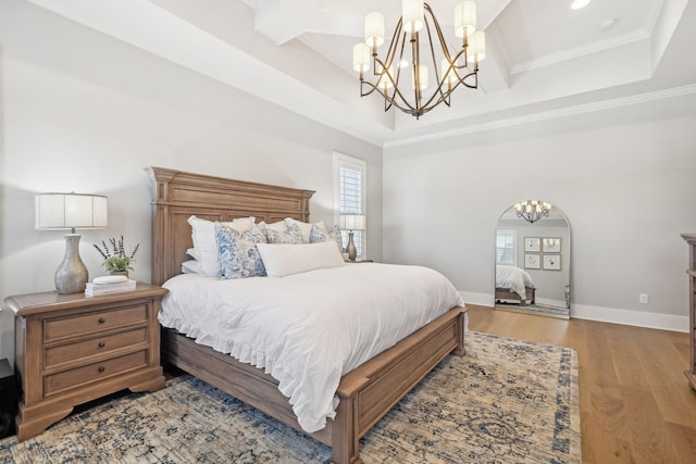 bedroom with beamed ceiling, light wood-type flooring, coffered ceiling, crown molding, and an inviting chandelier