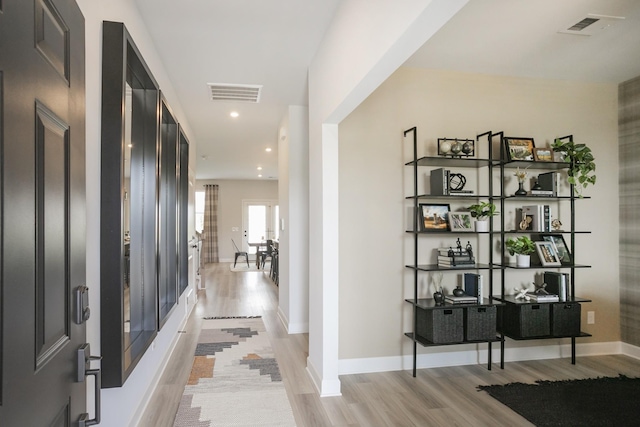 hallway featuring light wood-type flooring