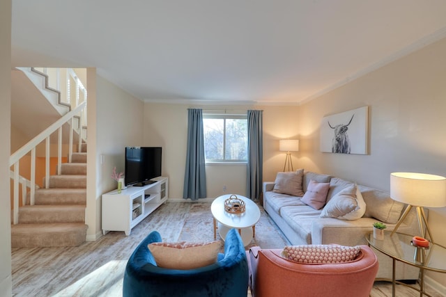 living room with ornamental molding and light wood-type flooring