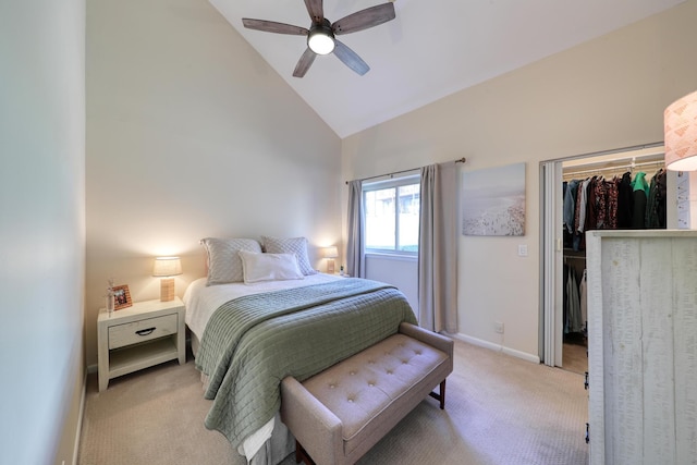 carpeted bedroom featuring a spacious closet, high vaulted ceiling, a closet, and ceiling fan