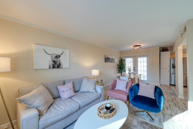 living room featuring ornamental molding and french doors