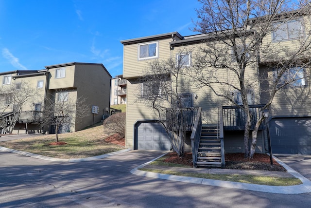 view of front of house featuring a wooden deck and a garage