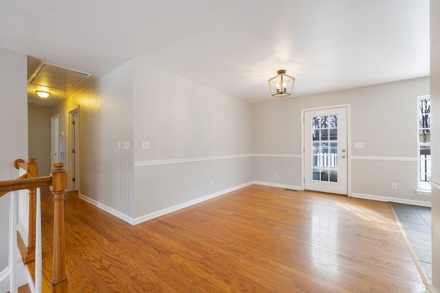 unfurnished room featuring hardwood / wood-style flooring