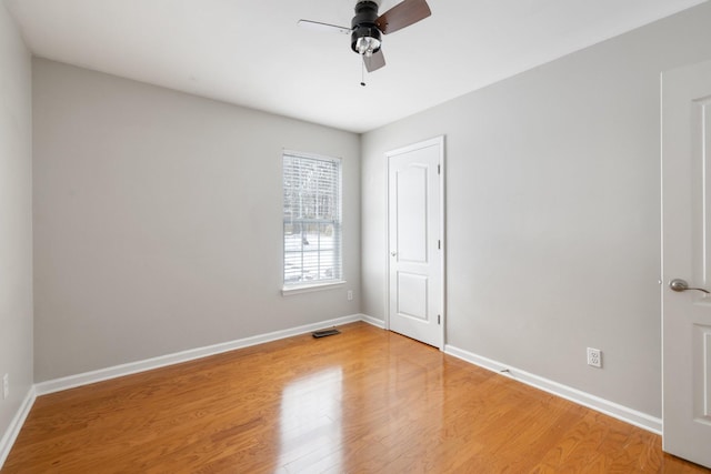 unfurnished room with hardwood / wood-style flooring and ceiling fan