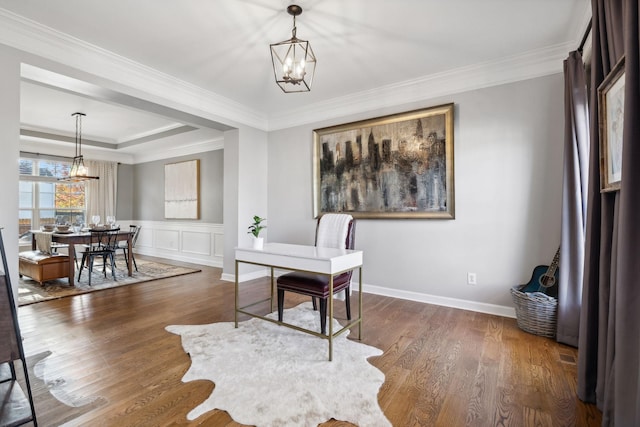 office area with an inviting chandelier, dark hardwood / wood-style floors, a raised ceiling, and crown molding