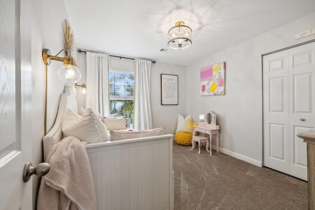 carpeted bedroom featuring a closet