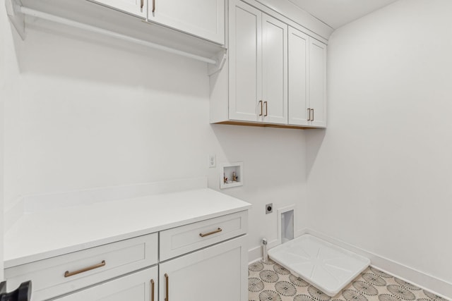 laundry room featuring hookup for a washing machine, cabinets, and hookup for an electric dryer