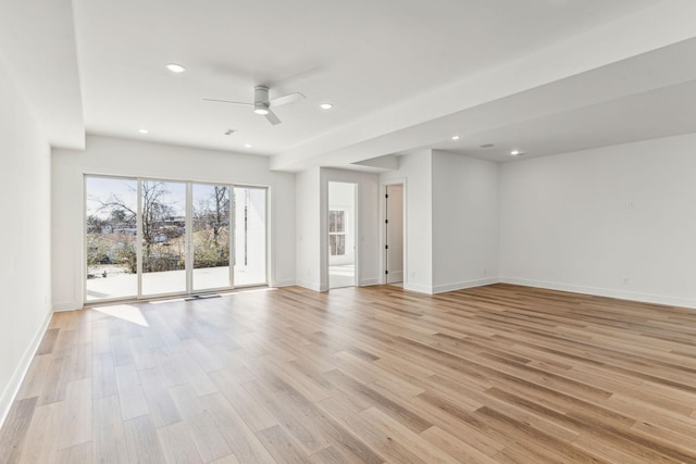 unfurnished room featuring light hardwood / wood-style floors and ceiling fan