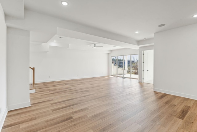 empty room with light hardwood / wood-style flooring