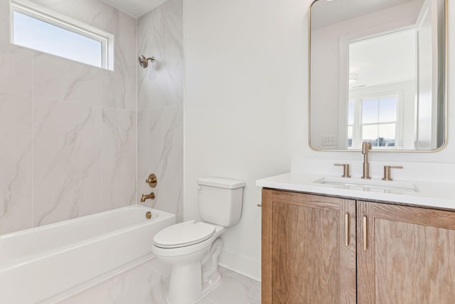 full bathroom featuring vanity, toilet, and tiled shower / bath combo