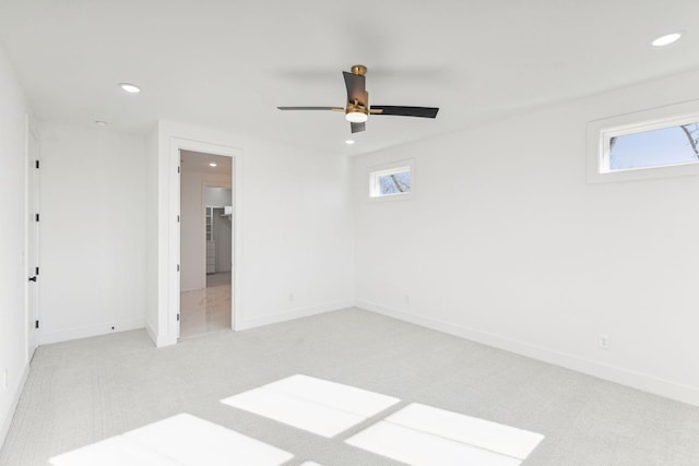 carpeted empty room with ceiling fan