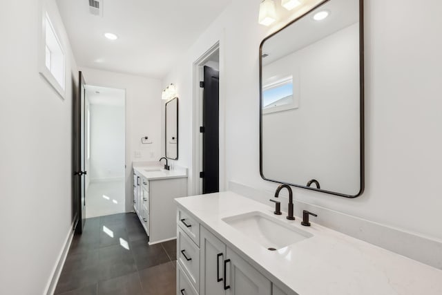 bathroom featuring vanity and tile patterned flooring