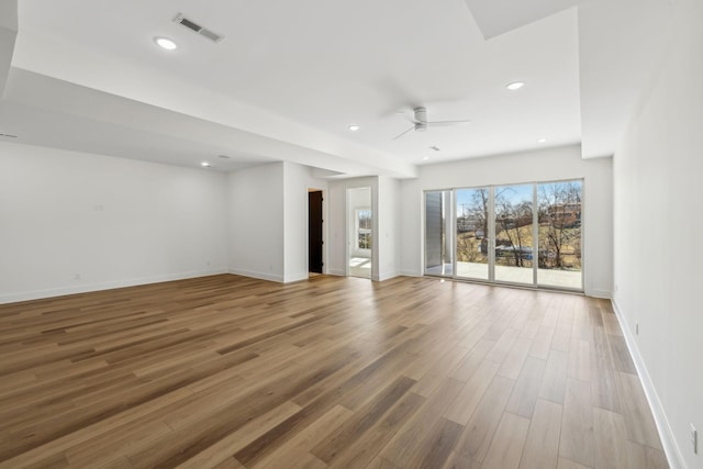 empty room featuring wood-type flooring and ceiling fan