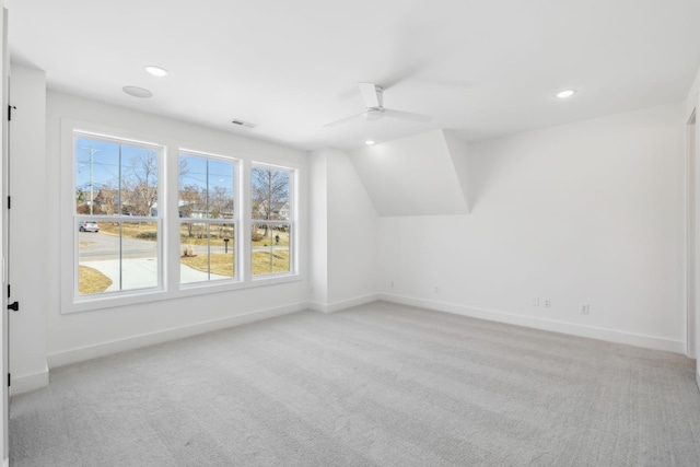 bonus room with light carpet, vaulted ceiling, and ceiling fan