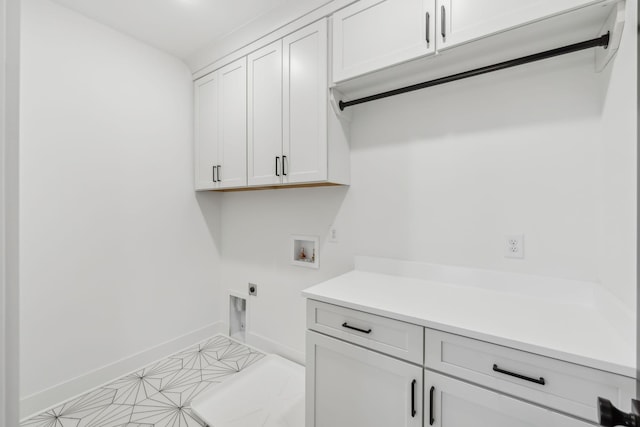 clothes washing area with cabinets, hookup for a washing machine, and hookup for an electric dryer