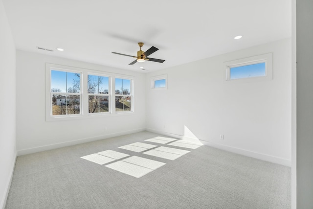 carpeted empty room featuring ceiling fan