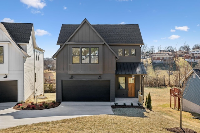 modern farmhouse featuring a garage and a front lawn