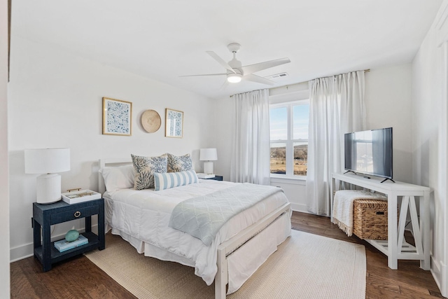 bedroom featuring ceiling fan and dark hardwood / wood-style floors