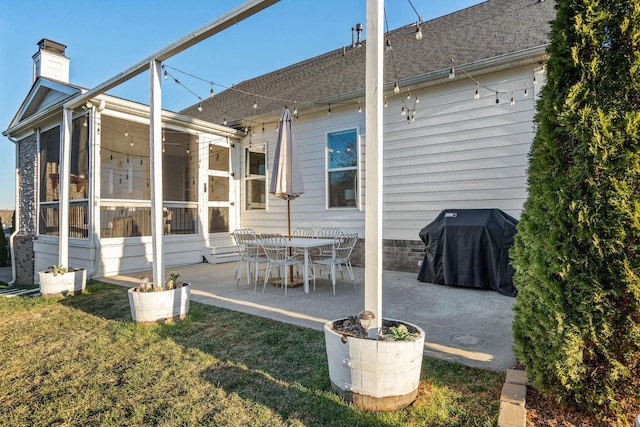 back of house with a yard and a patio area