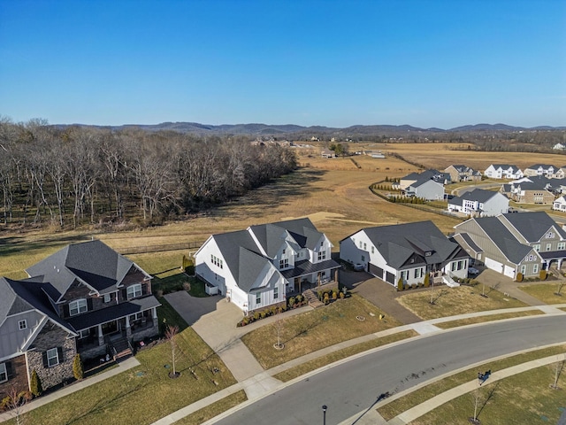 birds eye view of property featuring a mountain view