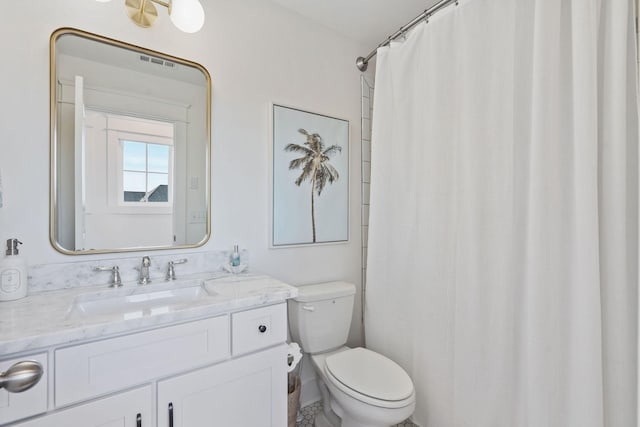 bathroom with vanity, toilet, and a shower with shower curtain