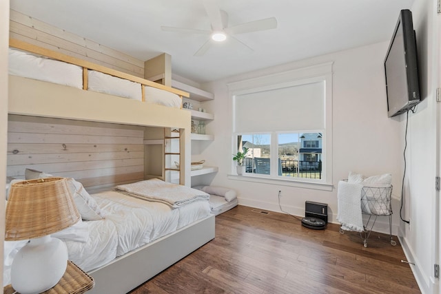 bedroom with dark wood-type flooring and ceiling fan