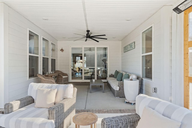 view of patio featuring an outdoor living space and ceiling fan