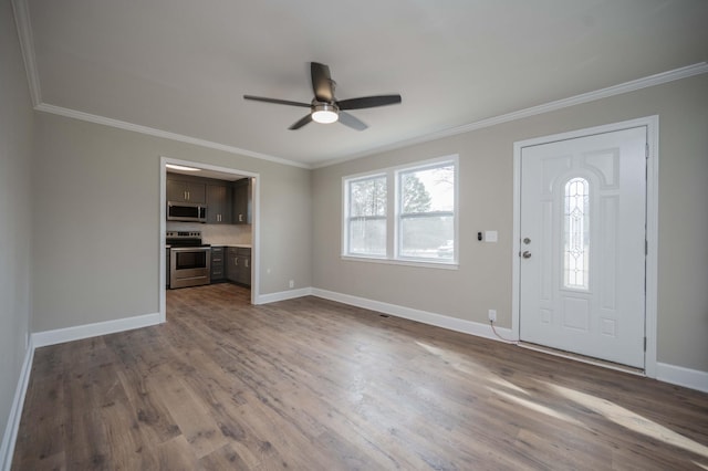 entrance foyer featuring wood-type flooring, ornamental molding, and ceiling fan