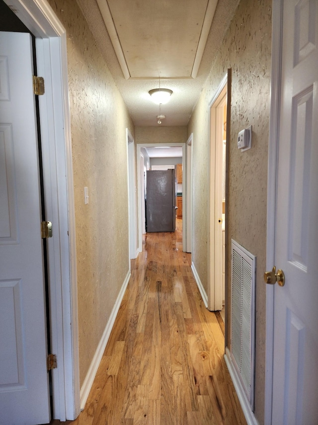 hallway featuring light wood-type flooring