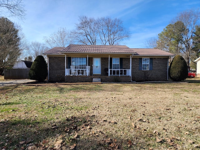 single story home with a front lawn and a porch