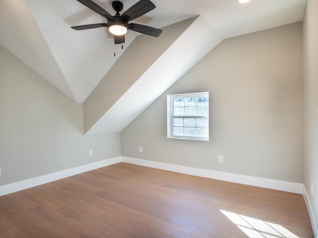 bonus room with lofted ceiling, ceiling fan, and light wood-type flooring