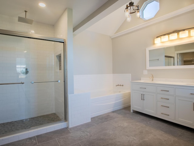 bathroom featuring lofted ceiling, vanity, and plus walk in shower