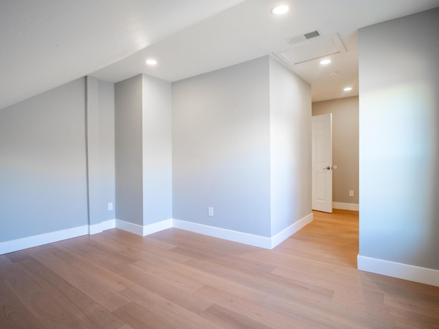 spare room featuring light hardwood / wood-style flooring